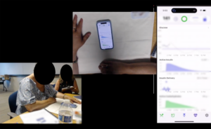 Screenshot of a recording from a study session. In the top left corner there is an overhead view of someone's hand on a phone, in the bottom left there is a view of the room with the participant and the moderator, and on the right side there is a large view of the phone screen which is directly mirrored.