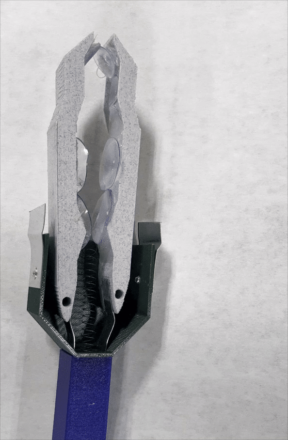 Moving GIF of a retractable reacher-grabber head prototpye.
